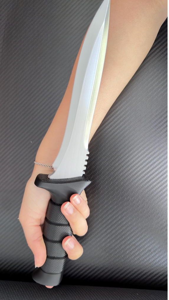 Leon Kennedy Primal Knife prop held for scale