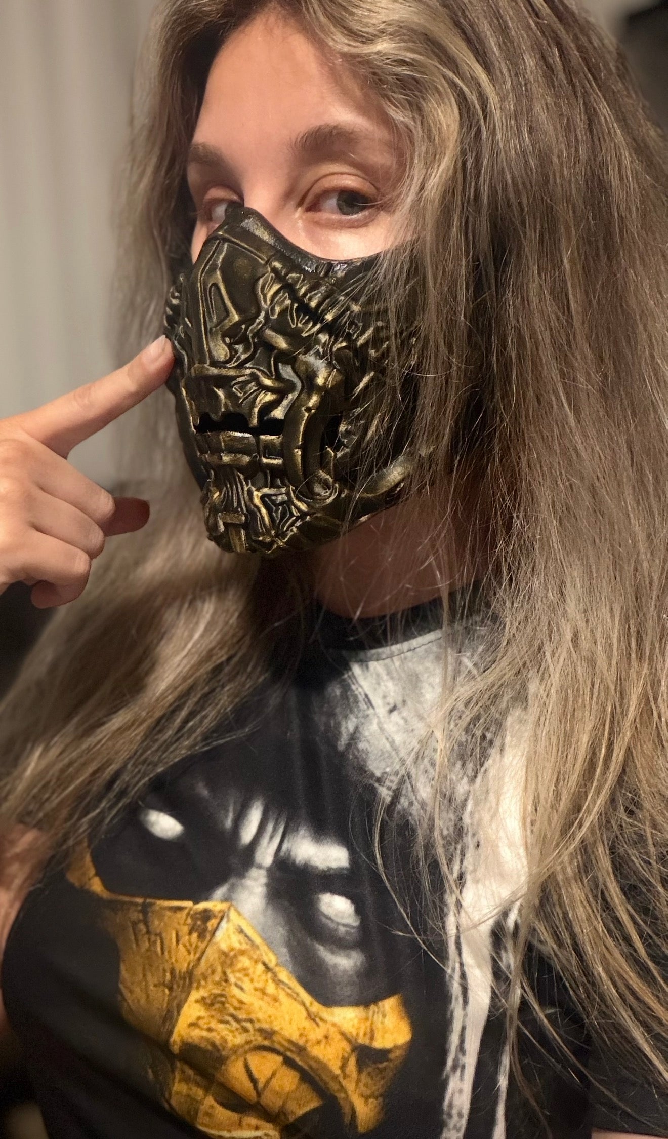 Scorpion mask cosplay prop from Mortal Kombat, shown for scale